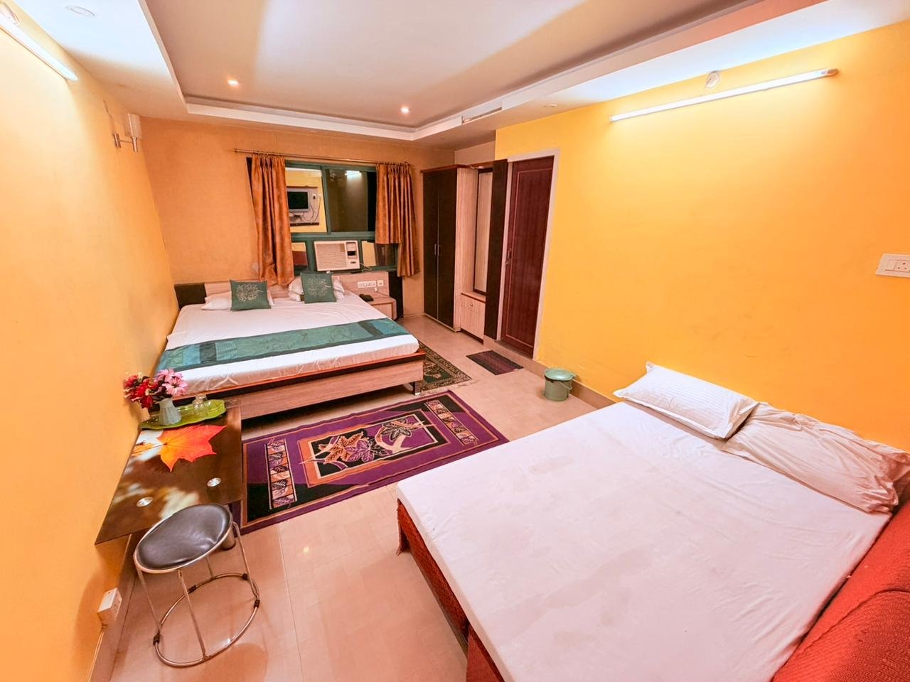 Large family room with a double bed and an additional bed